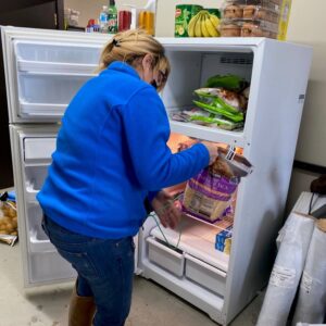 woman looking in the refrigerator